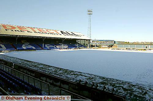 TALL ORDER: groundstaff are attempting to clear the frozen pitch 
