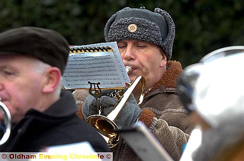 ROUSING . . . the brass band boosts morale 