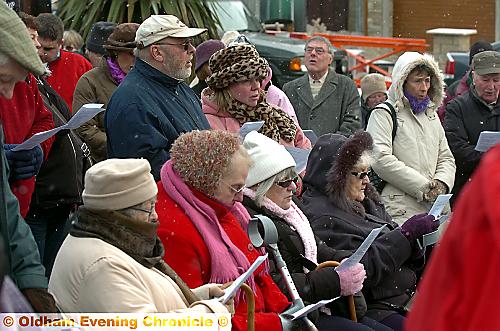 BRAVING the ice . . . dozens attended the service despite the conditions 