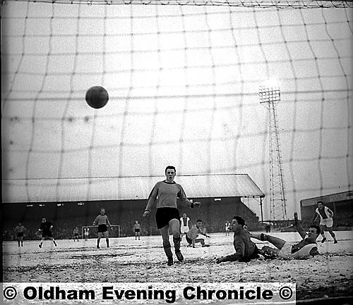 THOSE WERE THE DAYS: Legendary Athletic striker Bert Lister slides in to score the first of his six goals against Southport at a snow-covered Boundary Park on Boxing Day, 1962. Athletic won 11-0 — a new club record victory. 