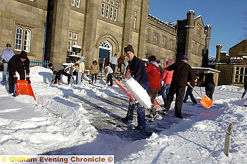 CLEARING the way . . . staff shovel the snow and ice at Blue Coat School 