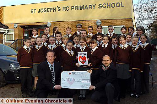 WE did it . . . pupils from St Joseph’s Primary School with teacher Steve Hill (front, left), and Marco Giannini, sporting event officer for the Christie charity 