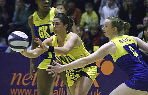 Rachel Henry (left ) attempts to get round the Team Bath defence. 