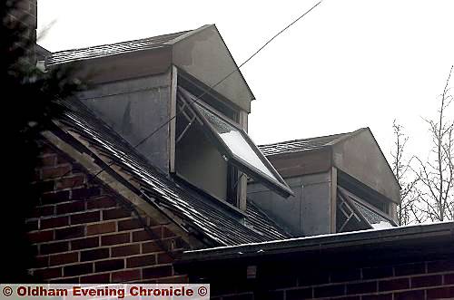 LUCKY escape . . . the window the woman scrambled out of before being rescued by firefighters LUCKY escape . . . the window the woman scrambled out of before being rescued by firefighters