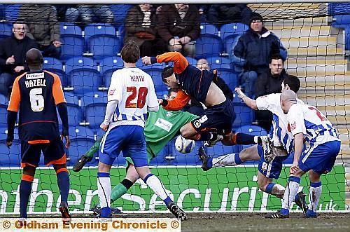 point-blank effort: Pawel Abbott is denied by Colchester United goalkeeper Ben Williams. 