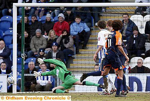 CLOSE CALL: On-loan forward Jason Price (number 11) looks on as his header beats Ben Williams buts hits the outside of the post. 