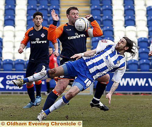 HANDS UP: Athletic captain Sean Gregan (left) and Steven Gillespie in the thick of the action.