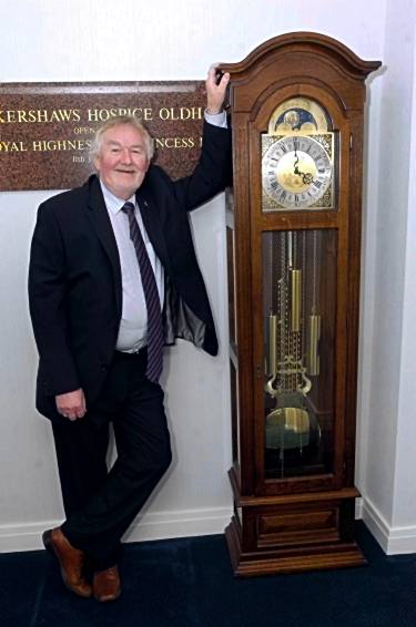 Brian Hurst with the grandfather clock Brian Hurst with the grandfather clock