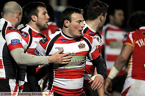 UP AND RUNNING: Paul O’Connor receives a pat from Neil Roden after putting the Roughyeds in front against Sheffield Eagles PICTURES by CHRIS SUNDERLAND 