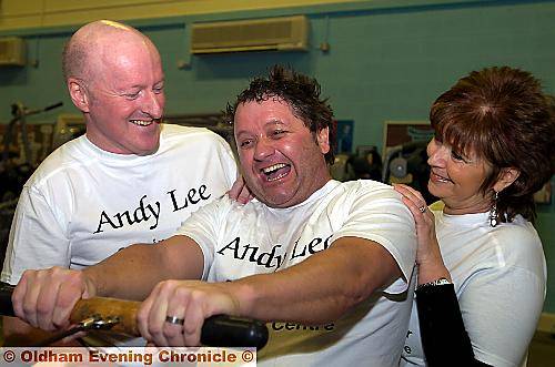 Andy Lee (centre) working out with the help of Oldham Cancer Support Centre’s Chris Hoyle and Beverley Heap 
