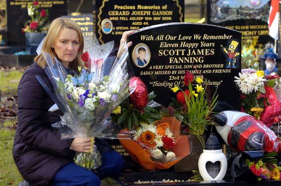 UPSET . . . Sharon Collins places fresh flowers on her son’s grave UPSET . . . Sharon Collins places fresh flowers on her son’s grave