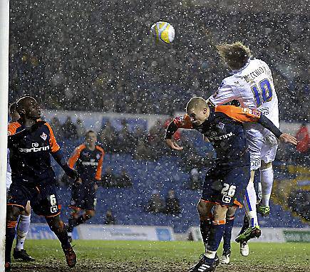 DOUBLE TROUBLE: Argentine striker Luciano Becchio makes it two after climbing above Alex Marrow 