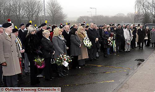 PAYING their respects . . . relatives, ex-servicemen and civic dignitaries line the Hartshead Moor memorial to honour the victims of the bombing 