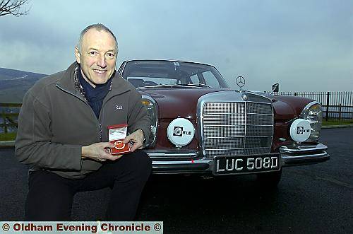TOOTHY grin . . . Saddleworth dentist Andrew Lane with his gold medal TOOTHY grin . . . Saddleworth dentist Andrew Lane with his gold medal