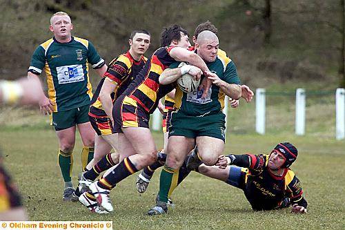 MARTIN RYAN (St Anne’s) takes on the Shaw Cross Sharks defence