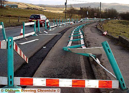 Smashing time . . . barriers on the road from Denshaw Smashing time . . . barriers on the road from Denshaw