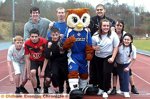 RADCLYFFE pupils in training with Chaddy the Owl and Latics players Kieran Lee (back left) and Kelvin Lomax (far right) 