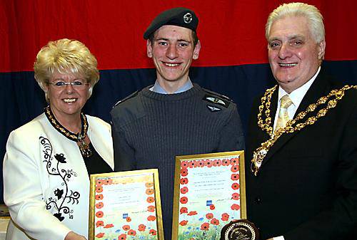 AWARD winner . . . . Cadet Sgt Christopher Hall with Mayor and Mayoress of Oldham, Councillor Jim McArdle and Councillor Kay Knox 