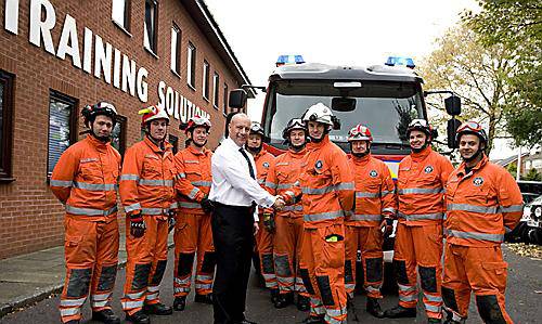 TRAINING complete . . . .Peter Jackson, ACE managing director, shakes hands with Watch Manager Joe Joseph, from Lancashire Fire and Rescue Service TRAINING complete . . . .Peter Jackson, ACE managing director, shakes hands with Watch Manager Joe Joseph, from Lancashire Fire and Rescue Service