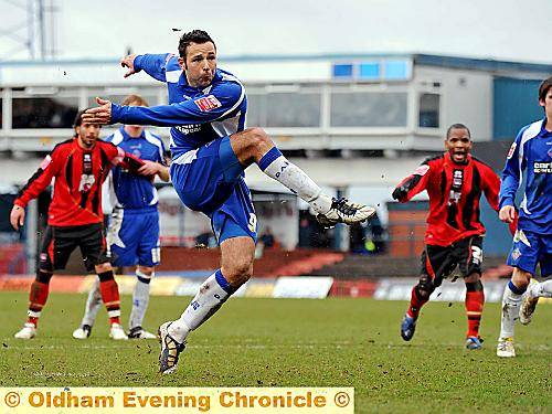 MISSED OPPORTUNITY: Pawel Abbott fires in the spot-kick, but it was saved by Brighton ’keeper Peter Brezovan. 