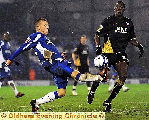 INSTANT IMPRESSION: Teenage winger Kirk Millar sticks out a leg in an attempt to control the ball. 