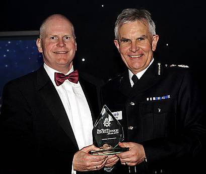 LIFETIME achievement . . . Sergeant Craig Johnson with Chief Constable Peter Fahy 