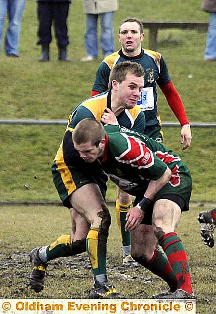 CRUNCH TIME: Waterhead’s Aaron Brown tackles St Annes’ Zak Cotton in their National Conference Division One clash at the weekend which finished with derby honours even after a 10-10 draw. 