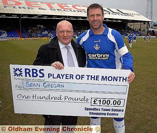 SHINING LIGHT . . . Sean Gregan receives his player of the month cheque for February from Mike Flaganan, manager of the Spindles Centre, sponsors of the award. SHINING LIGHT . . . Sean Gregan receives his player of the month cheque for February from Mike Flaganan, manager of the Spindles Centre, sponsors of the award.