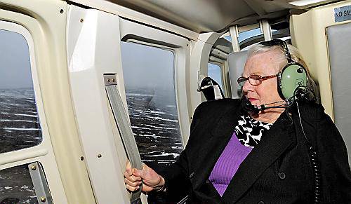 SITTING tight . . . Winnie on board the helicopter flight SITTING tight . . . Winnie on board the helicopter flight