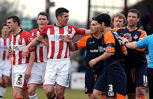 GET BACK: Exeter City’s Richard Duffy (third, left) and Athletic midfielder Dean Furman have a difference of opinion. 