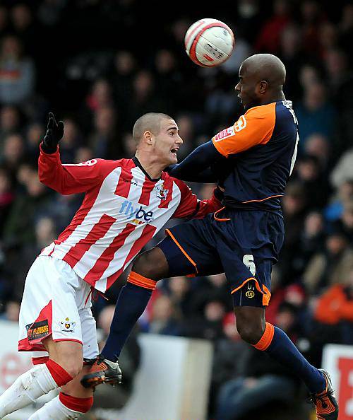 HEADS MASTER: Athletic defender Reuben Hazell beats Exeter City’s Marcus Haber to the ball. 