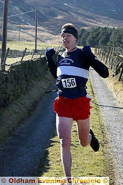 WINNER . . . Saddleworth Runners Club’s Sean Willis (above) crosses the finish line WINNER . . . Saddleworth Runners Club’s Sean Willis (above) crosses the finish line