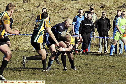 ON the charge: Higginshaw’s Carl Fields makes the hard yards against Rochdale Cobras.
