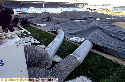 HOT-AIR blowers get to work to help thaw out the Boundary Park pitch.