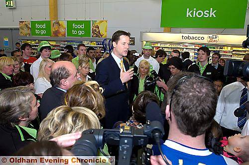 STRAIGHT TALKING . . . Nick Clegg is surrounded by staff and shoppers at Asda in Shaw 