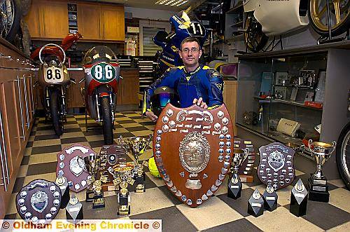 A YEAR in trophies . . . Steve Lawton with his bikes and his collection of awards.