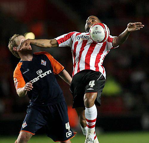 CHEST MATE: Athletic midfielder Jon Worthington (above) looks on as Jason Puncheon tries to bring the ball under control. 