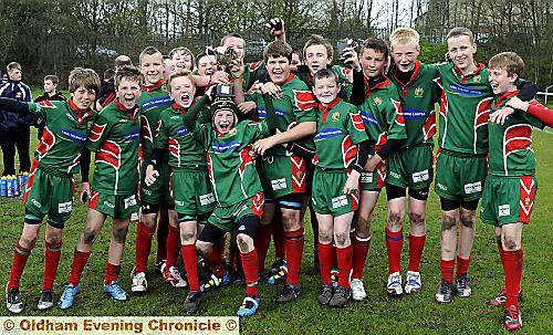Some thrilling rugby took place at the Oldham Chronicle Cup finals day, hosted by Saddleworth Rangers. Pictured are delighted Waterhead under-13s, who celebrated their win by lifting the trophy after collecting their medals. They beat the hosts, but Rangers went on to lift titles of their own in different age groups. Some thrilling rugby took place at the Oldham Chronicle Cup finals day, hosted by Saddleworth Rangers. Pictured are delighted Waterhead under-13s, who celebrated their win by lifting the trophy after collecting their medals. They beat the hosts, but Rangers went on to lift titles of their own in different age groups.