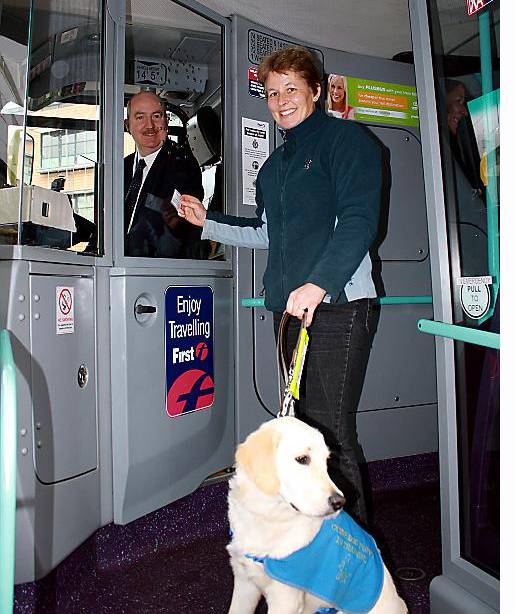 Puppy walker Isobel Cooper with dog Kaylea, and bus driver Steve Millen, testing the free travel scheme Puppy walker Isobel Cooper with dog Kaylea, and bus driver Steve Millen, testing the free travel scheme
