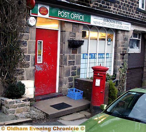 RAID fright . . . the post office in Woods Lane 