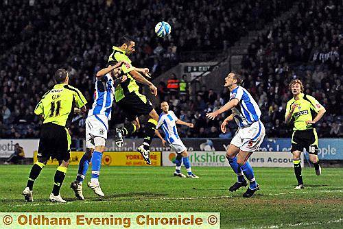 SO CLOSE: Pawel Abbott powers a header against the bar. SO CLOSE: Pawel Abbott powers a header against the bar.