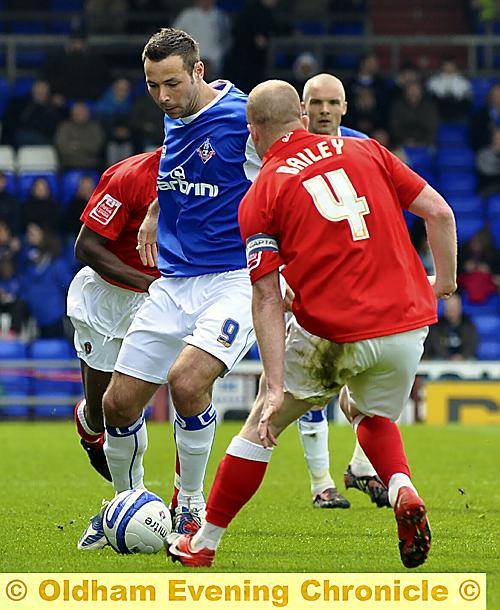 Athletic striker Pawel Abbott faces up to Charlton captain Nicky Bailey. PICTURES by TOM PICKLES and ALAN HOWARTH 