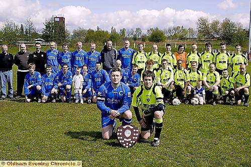 READY FOR ACTION: Rifle Range Royal Blue captain Andy Oakes (left) and Old Grey Mare skipper James Albert with the division two shield.