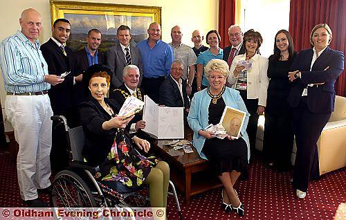 JAYNIE HUXLEY in the Mayor’s Parlour with some of the donations from the local business men and women, pictured with the Mayor and Mayoress, Councillors Jim McArdle and Kay Knox, and Youth Mayor Mohammed Adil (second left) 