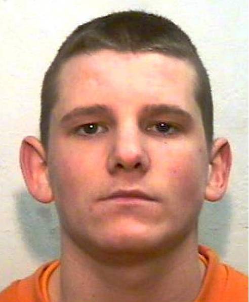 BEHIND bars . . . Aspin 