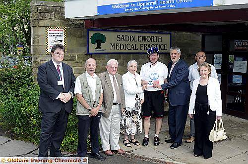 GRAHAM Box presents a “Proud to have a Patient Participation Group” sticker to volunteers at Saddleworth Medical Practice GRAHAM Box presents a “Proud to have a Patient Participation Group” sticker to volunteers at Saddleworth Medical Practice
