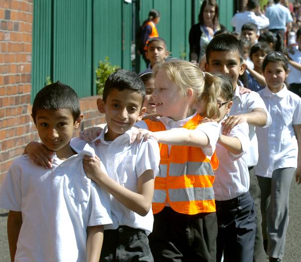 RECORD-breakers . . . pupils from Clarksfield Primary School form a walking bus RECORD-breakers . . . pupils from Clarksfield Primary School form a walking bus