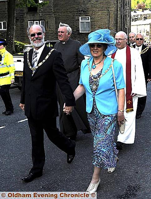 Saddleworth Parish Council’s new chairman Keith Begley and his his, Jenny, lead the procession Saddleworth Parish Council’s new chairman Keith Begley and his his, Jenny, lead the procession