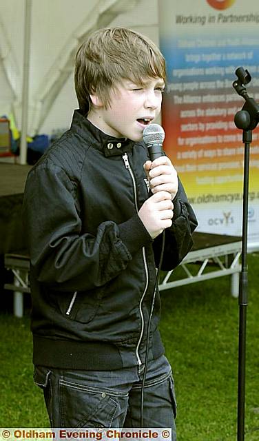 “X Factor” . . . Ryan Brogan (left) performs at the seventh annual Oldham Borough Games 