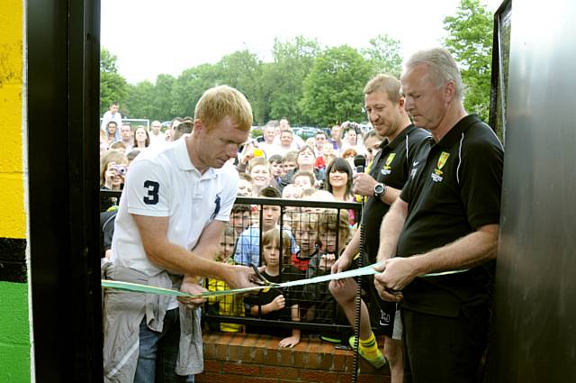 Manchester United’s Paul Scholes cuts the ribbon, held by chairman Frank Nolan, to the new changing rooms at Chadderton Park FC Manchester United’s Paul Scholes cuts the ribbon, held by chairman Frank Nolan, to the new changing rooms at Chadderton Park FC